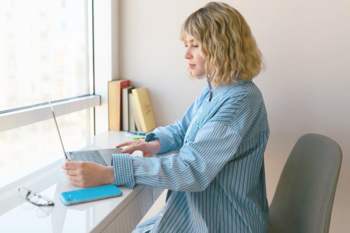 Financial analyst reviewing complex data visualizations and charts on multiple monitors