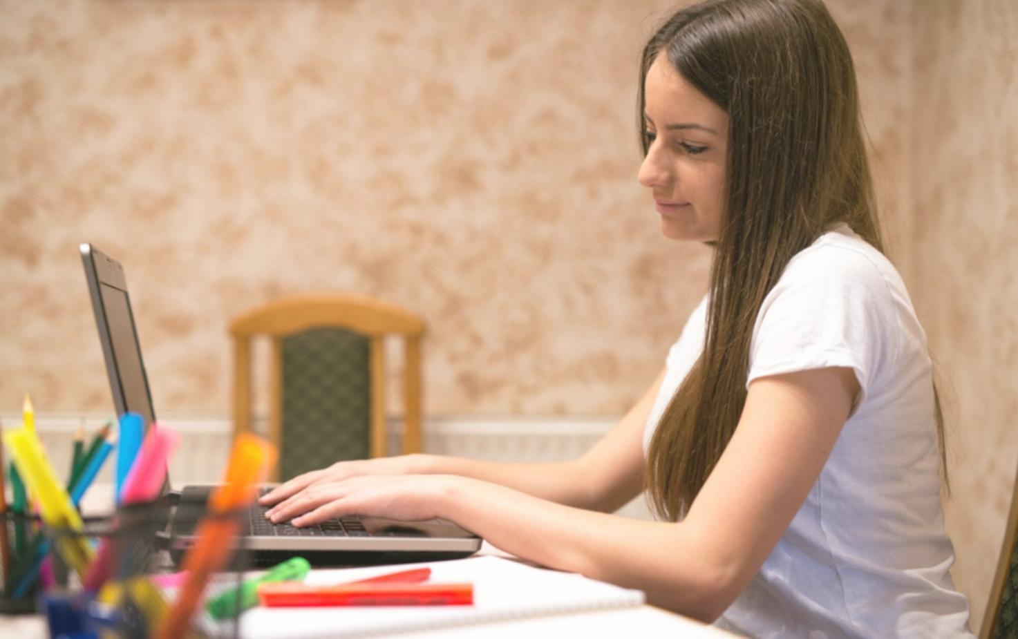 Students working together on financial analysis exercises in a modern classroom setting